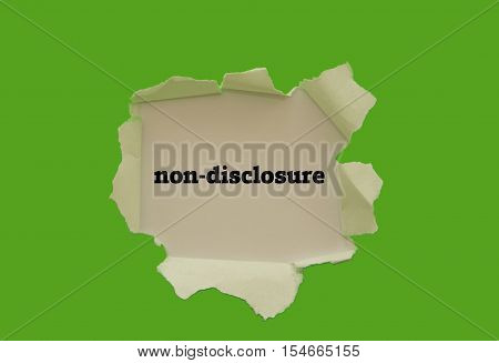 Non-Disclosure word written under torn paper .