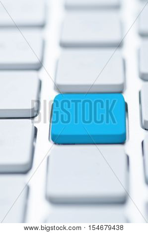 Macro shot of a blue key with bokeh effect. Selective focus