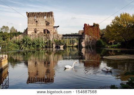 ancient Bridge upon the Mincio river in Borghetto Verona Italy