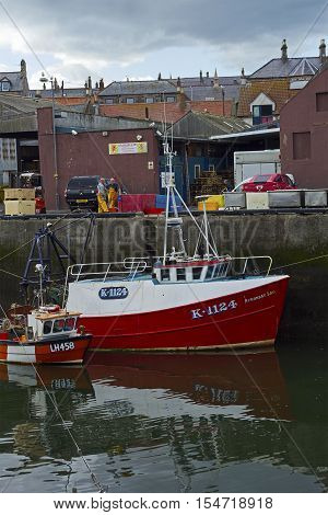Boats and houses in Eyemouth old fishing town in Scotland UK. 07.08.2015