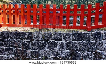 Old Stone Wall With Red Fench