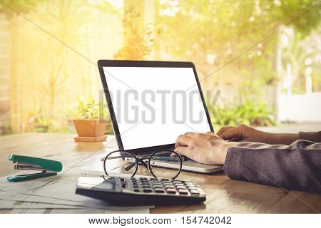 Business woman using laptop computer for work. vintage effect.