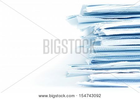 selective focus of closeup stack of the white newspaper paper