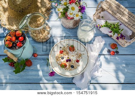 Summer breakfast in the garden on old table