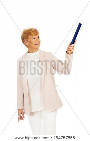 Smile elderly woman pointing up with hege pen