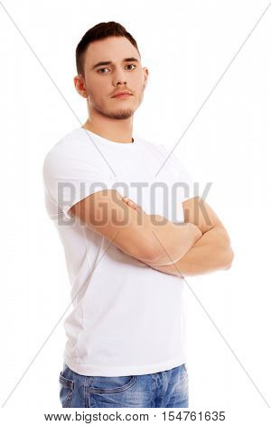 Young happy man with arms crossed