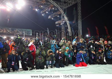 MOSCOW, RUSSIA - FEB 13, 2016: Photographers shoot during World Cup FIS Freestyle at dark night in Krylatskoye