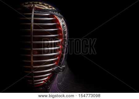 Head shot of kendoka on the black background
