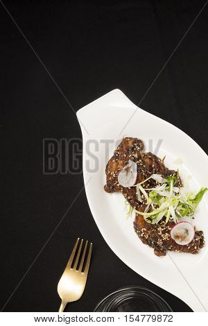 Chicken wing barbecue with sesame on dining table
