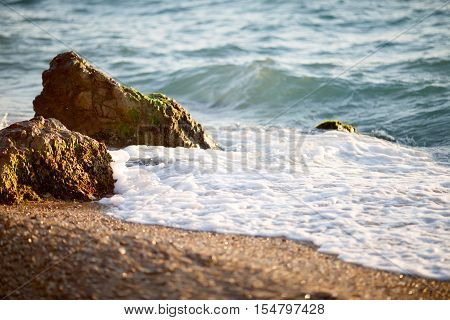 Picturesque beach with soft waves of the black sea. Serene seascape on summertime in good weather