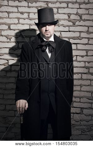 Victorian Man In The Black Coat, Top Hat And In A Tie