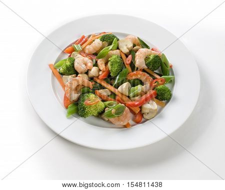 fresh shrimps and vegetables on white table.
