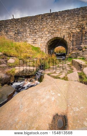 East Upper Burbage Bridge, with Burbage Brook flowing under it, located in the Peak District National Park