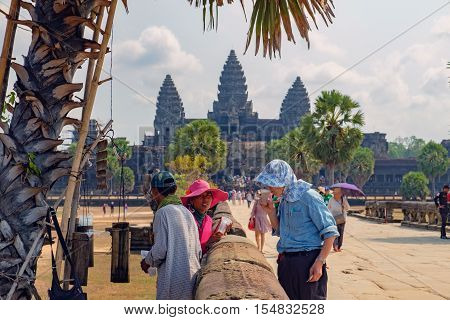 Siem Reap, Cambodia - February 1, 2016: Unidentified street vendor sells refreshing drink to tourists on the main road to Angkor Wat temple Siem Reap Cambodia.