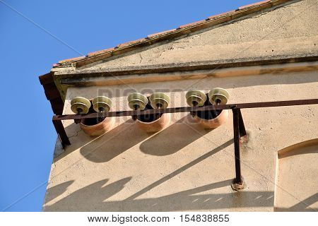 Old restraints for electrical cables already in disuse.