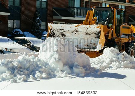 Clearing the road from snow Snow removal vehicle removing