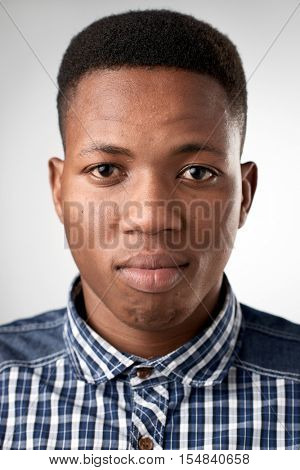 Portrait of real black african man with no expression ID or passport photo full collection of diverse face and expressions