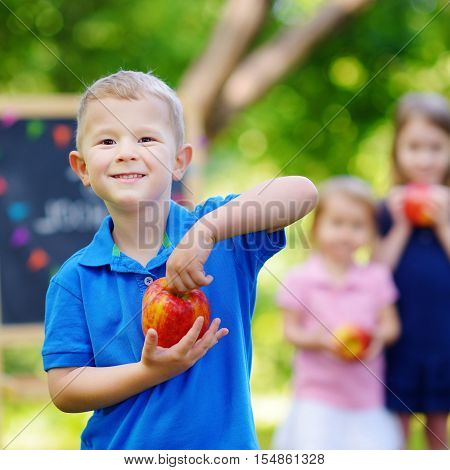 Adorable little boy feeling extremely excited about going back to school