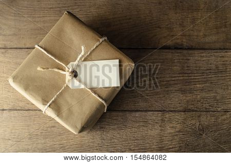 Brown Paper Parcel Tied With String And Blank Label