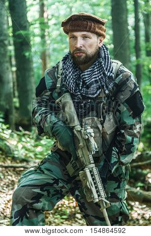 Member of Navy SEAL Team also known as Taliban hunter with weapons