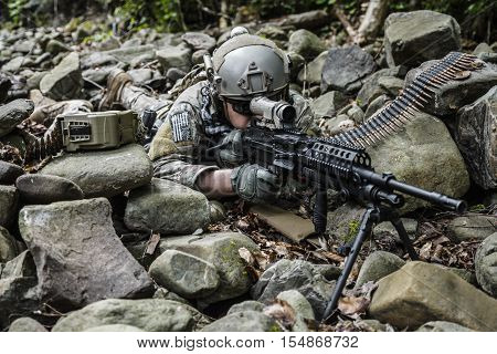 United states army ranger machine gunner in the forest
