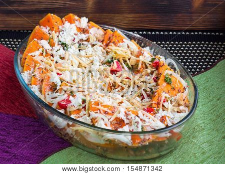 Vegetarian Dish Of Orange Pumkin, Vegetables, Herbs And Cheese