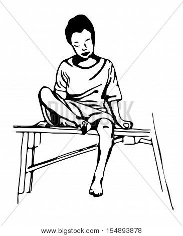 a young boy sits on a bench.