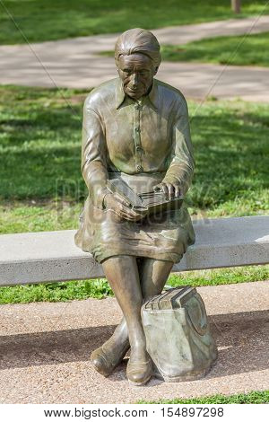 Springfiled Missouri USA- May 18 2014. Reading woman statue in Nathanael greene park Springfield Missouri.