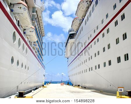 Two cruise ships docked side by side