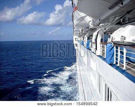 Lifeboats docked on a cruise ship at sea
