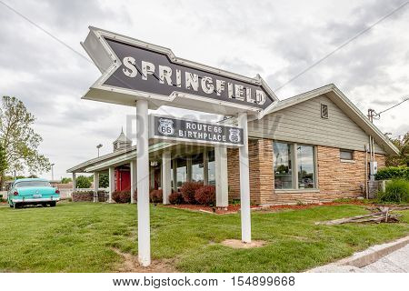 Springfiled Missouri USA- May 18 2014. Springfield road arrow sign with cafe background in best western route 66 rail haven.