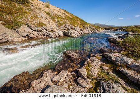 sunny landscape Norway mountains Dovrefjell river