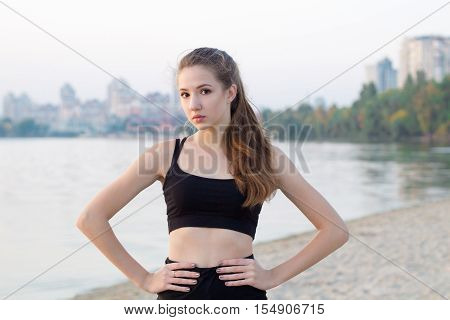 Young Woman Rests During Fitness Workout Exercises Outdoor In Morning