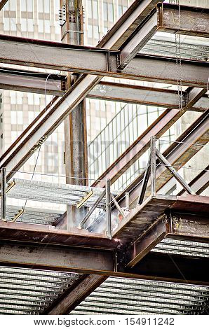 a construction worker working on highrise building