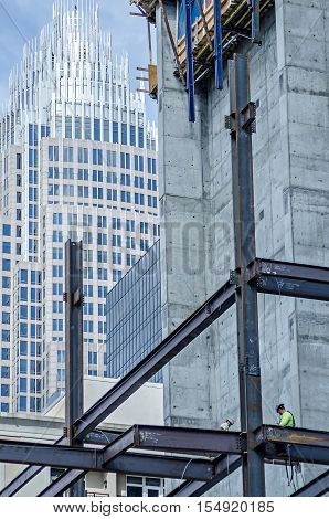 a construction worker working on highrise building