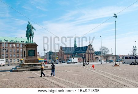 COPENHAGEN, DENMARK - APRIL 13, 2010: Equestrian Statue of King Frederik VII on Christiansborg Slotsplads (Castle Square). On the background is The Church of Holmen (Holmens Kirke)