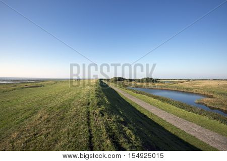View from Mando dike. Wadden Sea to the left and island to the right. Danish national park under UNESCO World Heritage.