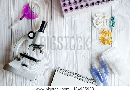 workplace lab assistant with microscope at the clinic top view no one