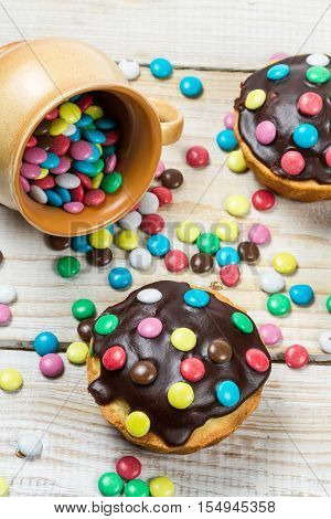 Closeu Of Muffins With Candies And Chocolate Glaze