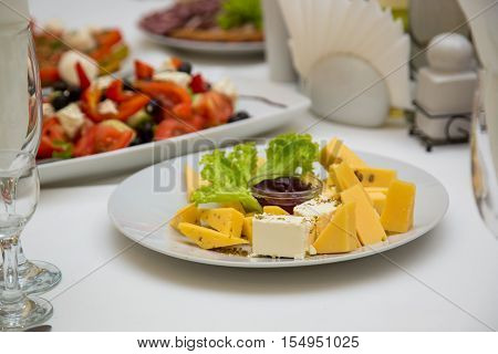 cheese plate on a decorated table. Bufet Table