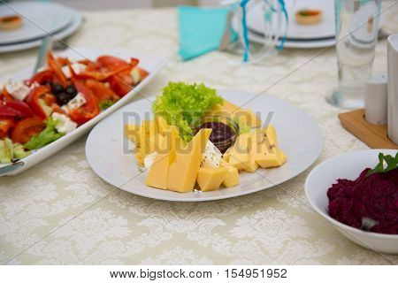 cheese plate on a decorated table. Bufet Table