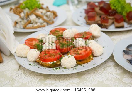 Salad of tomatoes peppers and cheese. Bufet Table