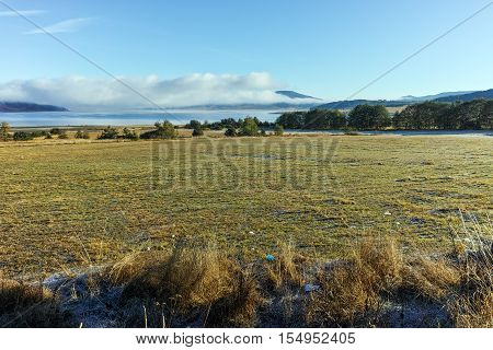 Panorama with Low clouds over water of Batak Reservoir, Pazardzhik Region, Bulgaria