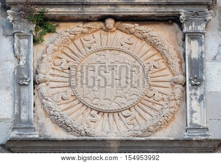 DUBROVNIK, CROATIA - NOVEMBER 29: IHS sign on church facade in Dubrovnik, Croatia on November 29, 2015.