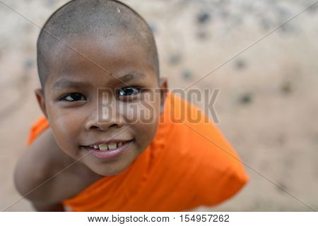 happy smile one Novice monk in Thailand
