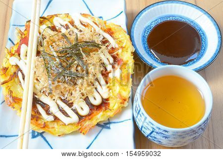 Japanese food okonomiyaki , Japanese pizza. Traditional food in Hiroshima, Japan