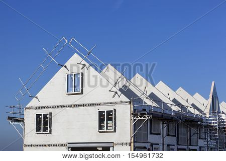 Construction site with houses with prefabricated walls in the Netherlands