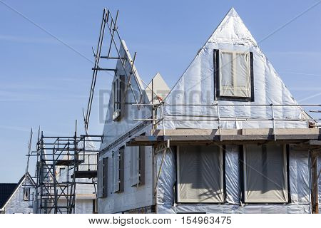 Construction site with houses with prefabricated walls in the Netherlands