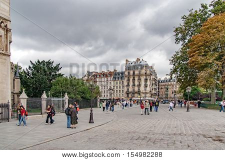 PARIS, FRANCE, april 23 2016. PARIS, FRANCE, CIRCA APRIL 2016. At the zero point of the roads of France, in front of the facade of Notre Dame de Paris on the ille de la cite