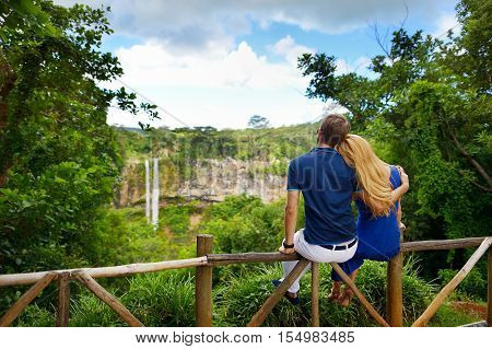 Young Couple Enjoying A View On Chamarel Falls Of Mauritius